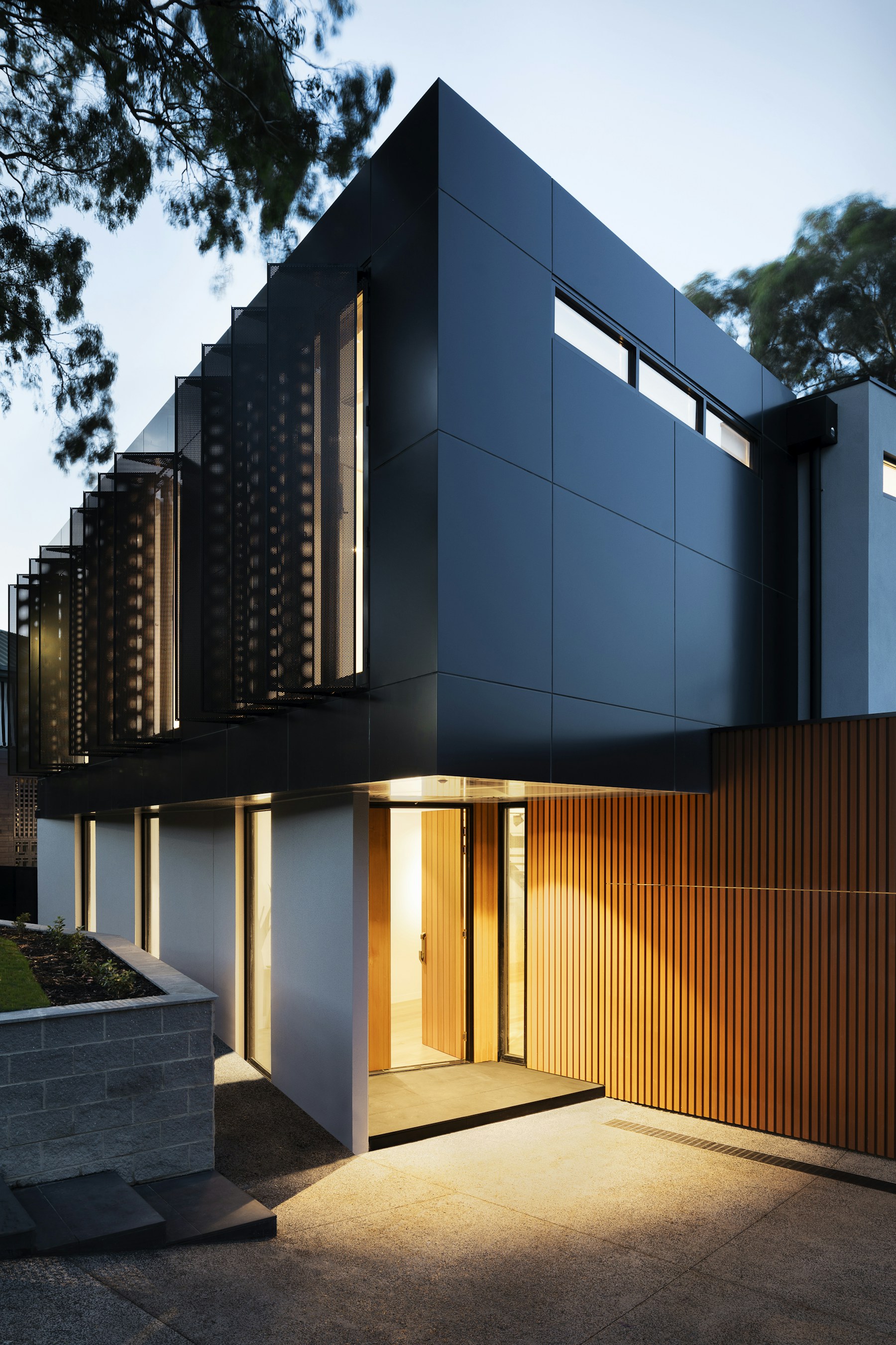 Placeholder photograph of a low modern house on a landscaped lot
